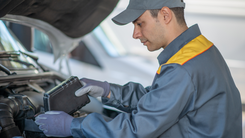 A man putting coolant into his car 