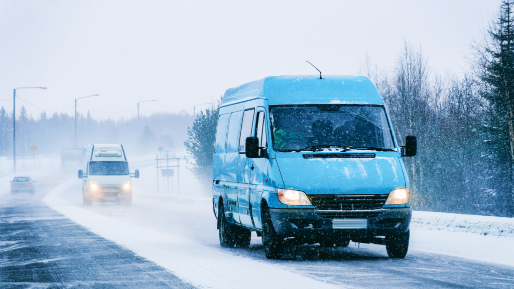 a van in the snow illustrating good stopping distance and safety tips for same day couriers